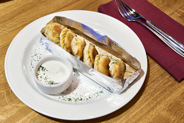 Fried dumplings with sour cream