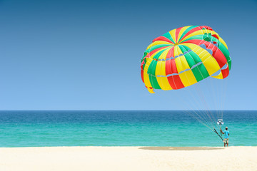 Parachute for tourist on sand beach