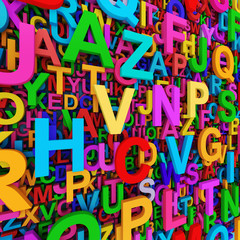 Naklejka premium Alphabet background with mixed colorful letters. 