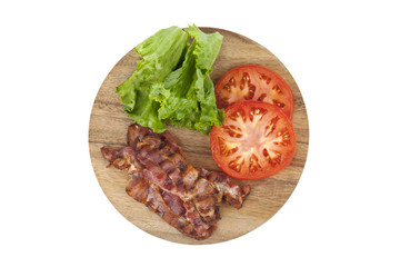 bacon, tomatoes, and lettuce in a wooden plate