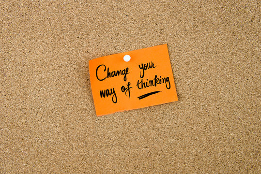 Change Your Way Of Thinking Written On Orange Paper Note