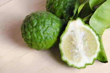 Bergamots fruit with leaf on wooden board