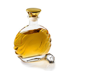 Bottle whiskey and watch on white background