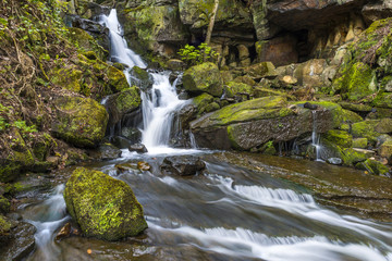 Naklejka na ściany i meble Waterfall in Lumsdale Valley in Matlock, Derbyshire, UK