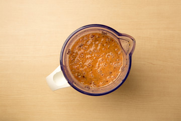 Freshly made mango, dragon fruit and tomato and blender, clean food, view from above