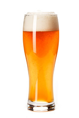 Beer Glass isolated. Beer glass on white background. Bar drink. Beer bubbles closeup. Lager. Overflow beer glass. Beer beverage. Glass of alcohol. Closeup draft beer glass. Cold Beer. Pint of beer.