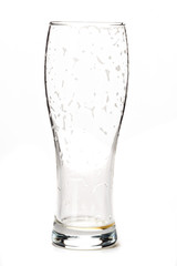 EMPTY GLASS of DRAFT BEER. Fresh gold cold and delicious. Beer in curvaceous glass. Good for brewery of oktoberfest commercial. White background