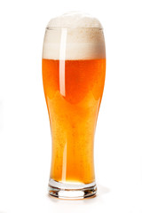 Beer Glass isolated. Beer glass on white background. Bar drink. Beer bubbles closeup. Lager. Overflow beer glass. Beer beverage. Glass of alcohol. Closeup draft beer glass. Cold Beer. Pint of beer.