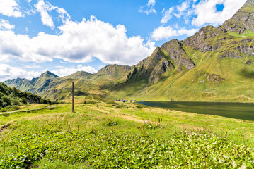 Old wooden cross in the park of the alpine lakes, Cadagno. Piotta, canton Ticino of Switzerland.