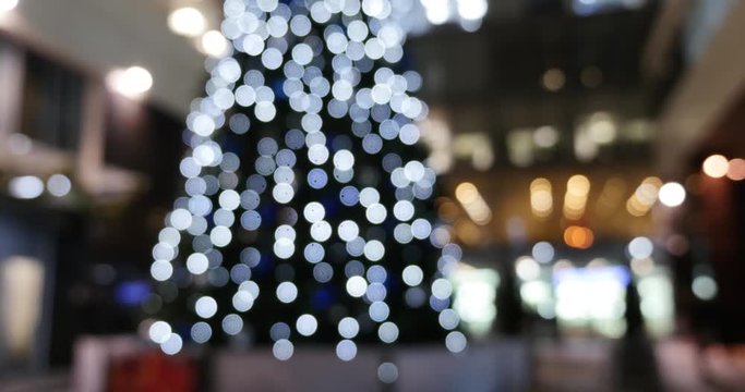 Christmas tree near office building, pan up