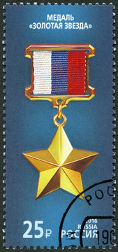 RUSSIA - 2016: shows The Gold Star on the blue background