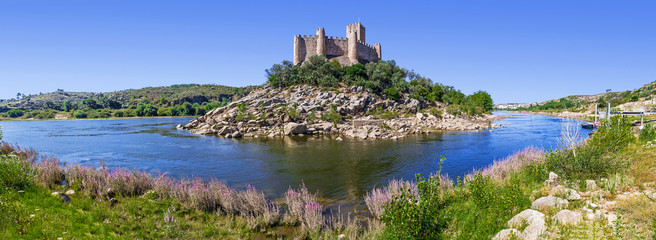 Fototapeta na wymiar Panorama of the Templar Castle of Almourol and Tagus river. One of the most famous castles in Portugal. Built on a rocky island in the middle of Tagus river.