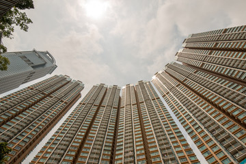 Tall building pictured from below with sky