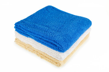 Stack of towels on a white background.
