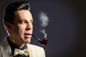smokes a pipe