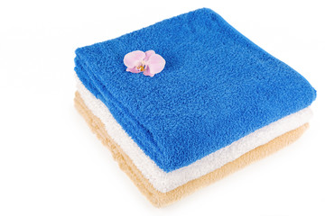 Stack of towels on a white background.