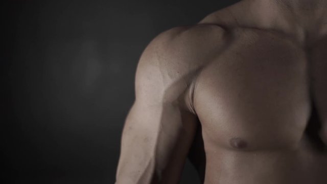 Muscular man on a black background