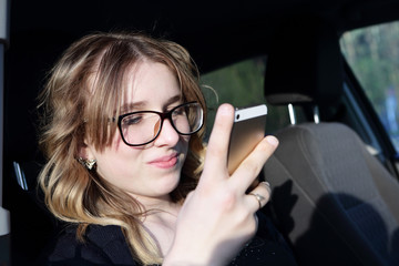 Fototapeta na wymiar Smiling teen with smartphone
