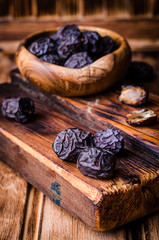 Fresh Dates on vintage wooden background. Selective focus. Toned image