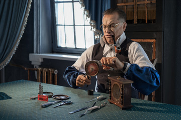 A man repairing clocks