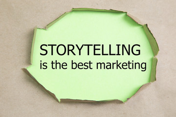 The motivational quote Storytelling is the best Marketing, appearing behind torn paper.