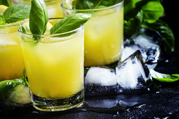 Alcoholic cocktail Basil smash with green basil, gin, sugar syru