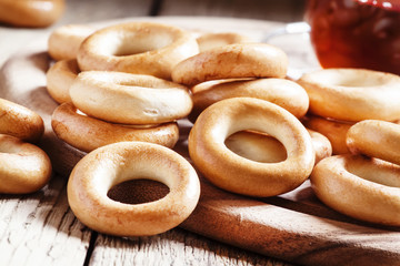 Bagels and tea, vintage wooden background, selective focus