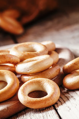 Bagels and tea, vintage wooden background, selective focus