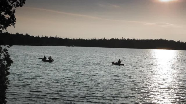 Tracking shot of silhouette of boats in a bay; Georgian Bay; Tobermory; Ontario; Canada