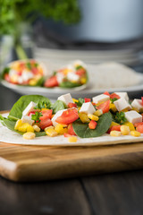 vegan tofu wraps with pepper, corn, tomatoes and spinach