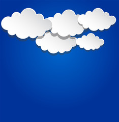 Paper clouds on blue background.