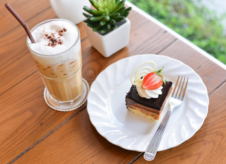 Cheesecake with chocolate with fresh strawberry and ice cappuccino