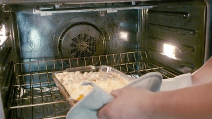 Pulling Baked Yums WIth Melted Marshmellows Fresh and Hot Out of the Oven