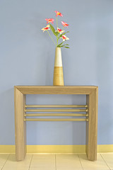 Vintage Flower Vase on the table against grey wall