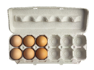 half a dozen of brown eggs in a cardboard tray.