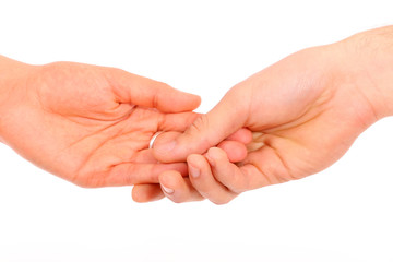 Close-up of a woman and a man holding hand in hand on a white background