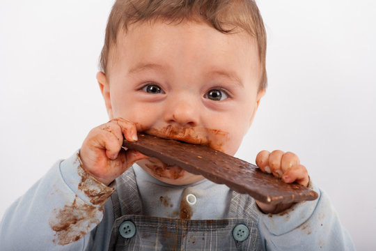 Baby eating chocolate