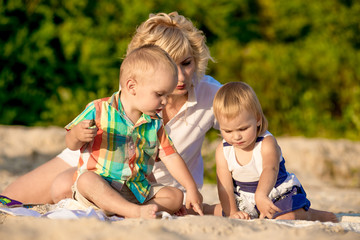 mother with two children on beach