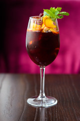 wine cocktail with mint garnish.
