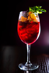 wine cocktail with mint garnish.