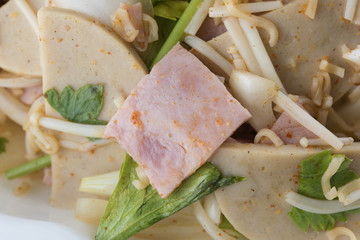 Spicy Thai food yum spicy pork and ham with onion, lettuce and mashroom. hot and spicy