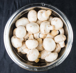 champignons in a metal bowl