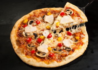 pizza on the board with ham
