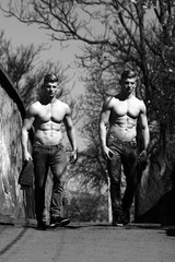 Fototapeta na wymiar Twin muscular bare-chested men