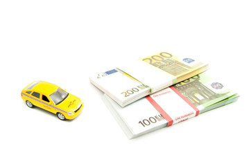 yellow taxi car and banknotes
