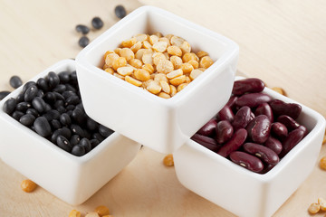arrangement of assorted beans on a white bowl