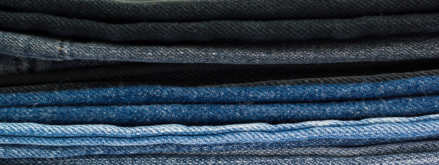 pile of denim jeans