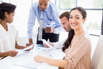 Businesspeople discussing a report