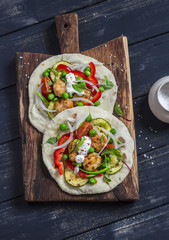 Chicken meatballs and fresh vegetables tacos. Healthy delicious breakfast or snack. On wooden rustic board