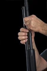 Deurstickers Gunsmith removing barrel of a 20 gauge pump action shotgun for cleaning © sheilaf2002